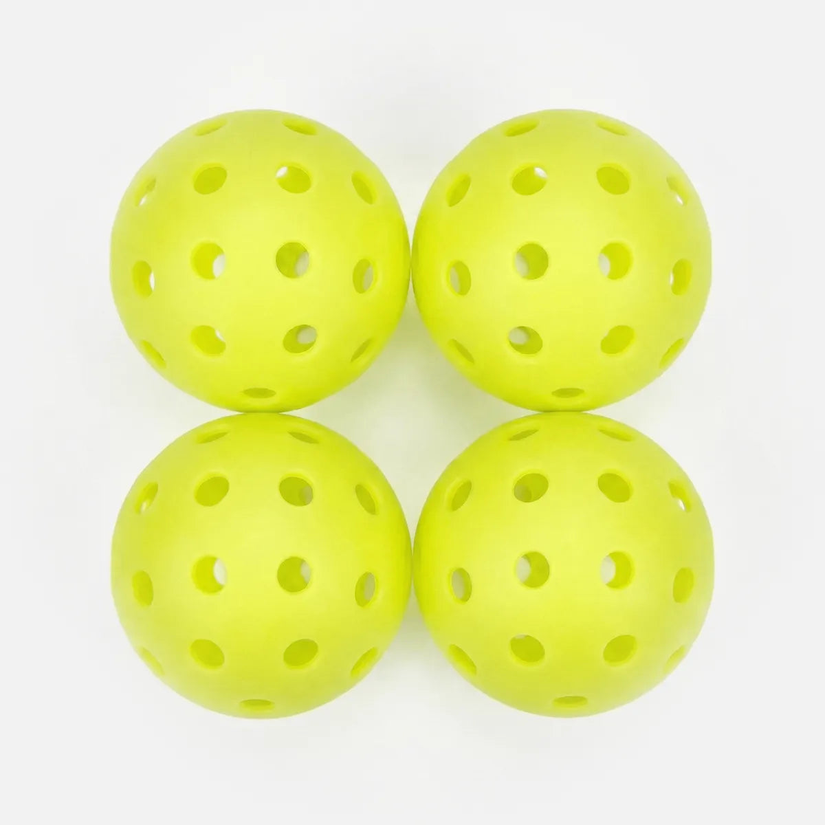 Fluorescent yellow outdoor pickleball balls 4 pack on white background