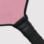 Black ribbed handle ring installed on a pickleball paddle